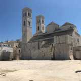 Di fronte all�Adriatico si innalza l'ala sinistra dell'indiscusso simbolo cittadino: il duecentesco duomo di San Corrado, pregevole esempio di romanico pugliese. Da qui sono ben visibili le sue due caratteristiche torri, con quella lato mare ideata per fungere da vedetta
