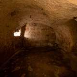 Ci troviamo infatti in quella che nel Medioevo era una chiesetta rupestre dedicata a San Giovanni delle Camere. L'intitolazione del luogo sacro derivava probabilmente dalla sua pianta a croce greca, sovrastata da una cupola detta appunto "camera"