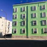 Qui le palazzine assumono un colore verde pastello
