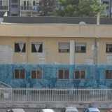 Prospetto dell'ex Liceo Socrate, situato a Bari in via Fanelli, dipinto da Ericailcane e Blu nel Novembre 2012