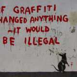 L'opera di Bansky apparsa per le strade di Londra nel 2011