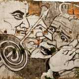 Murales del Collettivo FX realizzato nel giugno 2014 nella Caserma Rossani. L'opera raffigura l'architetto Massimiliano Fuksas intento a rubare a San Nicola una delle sue palle