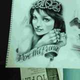 Un disegno realizzato per un tatuaggio che raffigura il volto della propria fidanzata