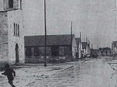 A met� strada si trovava la chiesa principale: una baracca che fu poi demolita nel 1960 per far spazio alla chiesa di San Vito