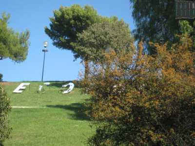 Quel che resta della scritta Ecopoli realizzata in stile Hollywood
