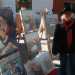 Piero Arcieri accanto ai suoi dipinti in mostra in via Sparano
