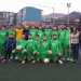 La squadra del San Michele Rufoli con la sua allenatrice sul campo di calcio