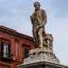 Dallalto di un piedistallo posizionato allestremit della verde piazza Massari, si affaccia sul corso il musicista barese che ha dato il nome al politeama: Niccol Piccinni. La scultura che lo ritrae  fu approntata nel 1885