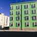 Qui le palazzine assumono un colore verde pastello