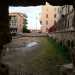 ...e via Calace, lungo la quale un buco in un muro ci rivela, indiscreto, il campetto di calcio del quartiere 