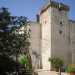 Siamo in piazza Gualtieri, nel rione Canneto di Adelfia. Di fronte a noi si erge la torre di guardia del castello del marchese Nicolai, eretto tra il 1147 e il 1153. La torre  alta 19 metri e permetteva di controllare il territorio circostante, per farsi trovare pronti in caso di attacchi nemici