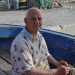 Giuseppe Pupillo, 78enne pescatore barese e proprietario di tre pescherecci, mentre aggiusta una rete