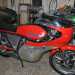 Luomo ci guida allinterno del suo covo. Ammiriamo unAgusta MV 350 del 76 rosso che Giovanni considera il suo gioiellino
