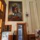 Proseguendo verso la navata sinistra, sopra l�ingresso per la sagrestia e gli uffici parrocchiali, spicca la tela di San Rocco